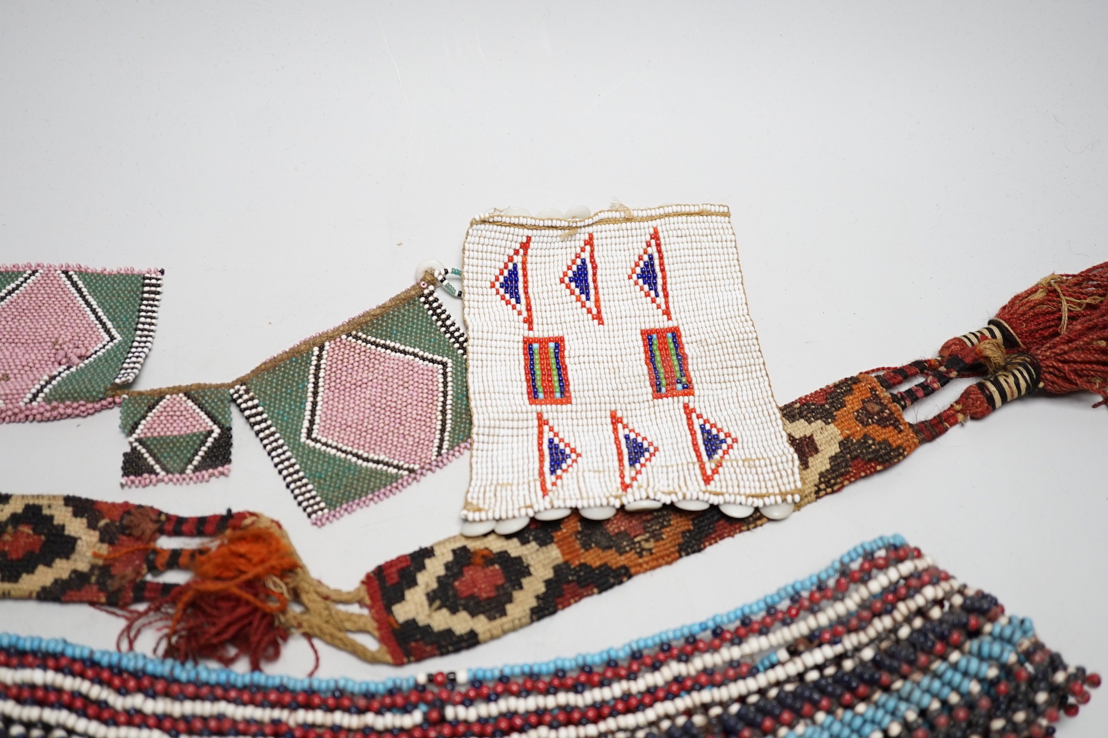 A selection of tribal geometric beadwork, to include a waistband believed to be Zulu